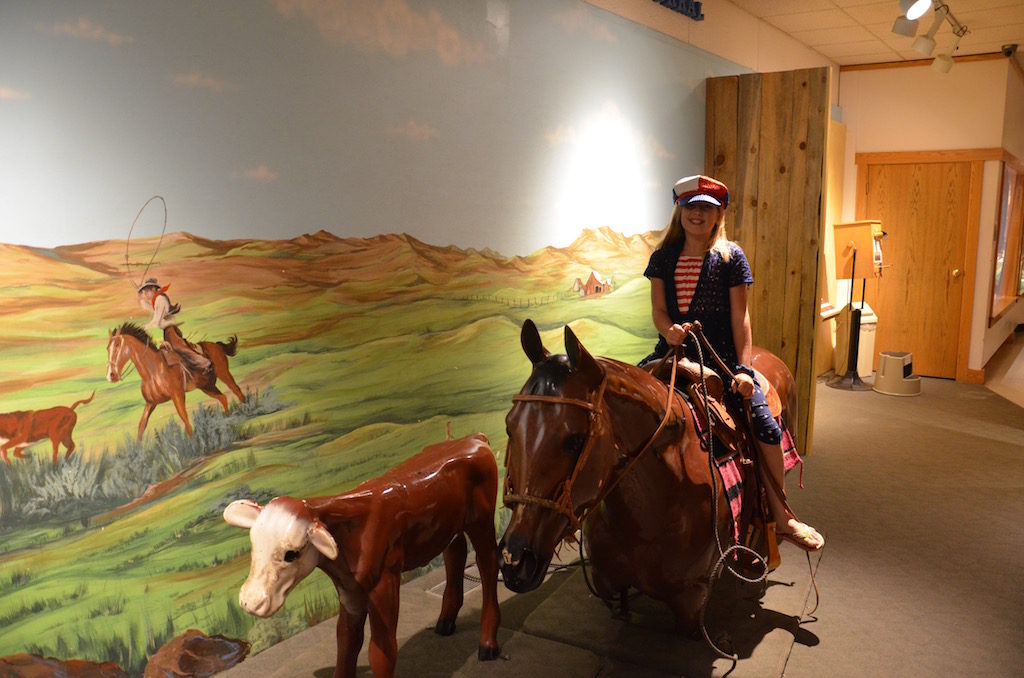 Just can't keep her off the horses!