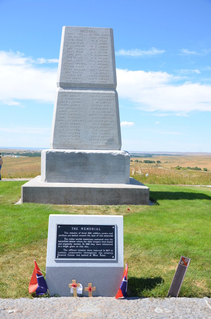 This enclosed cemetery was the men in Custer's command. The black stone is Custer.