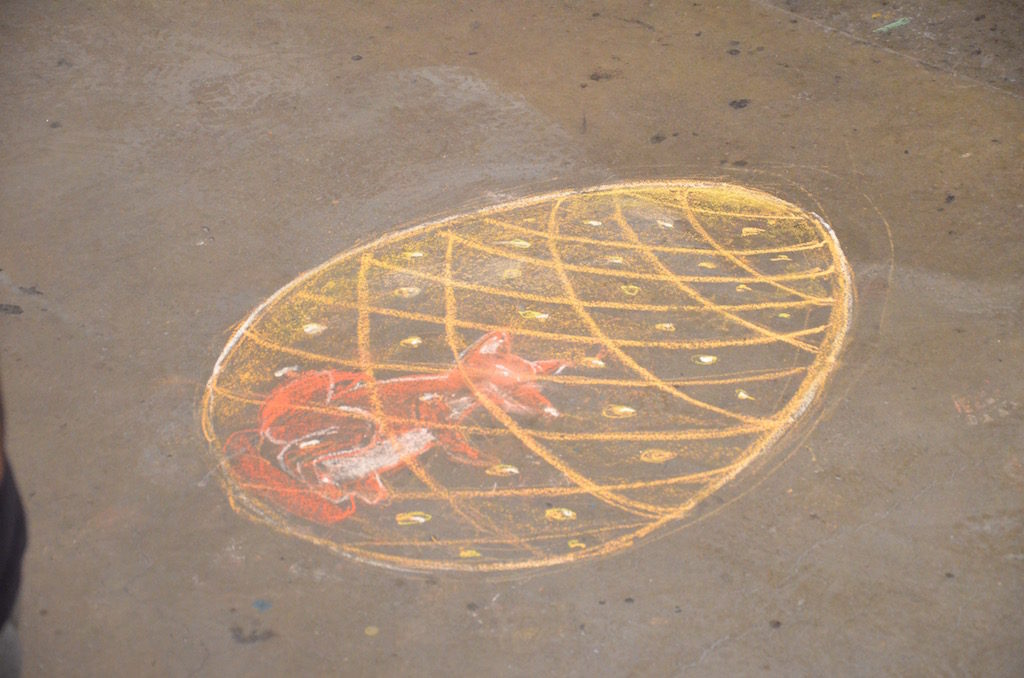 The finished design drawn in colored chalk for their reference